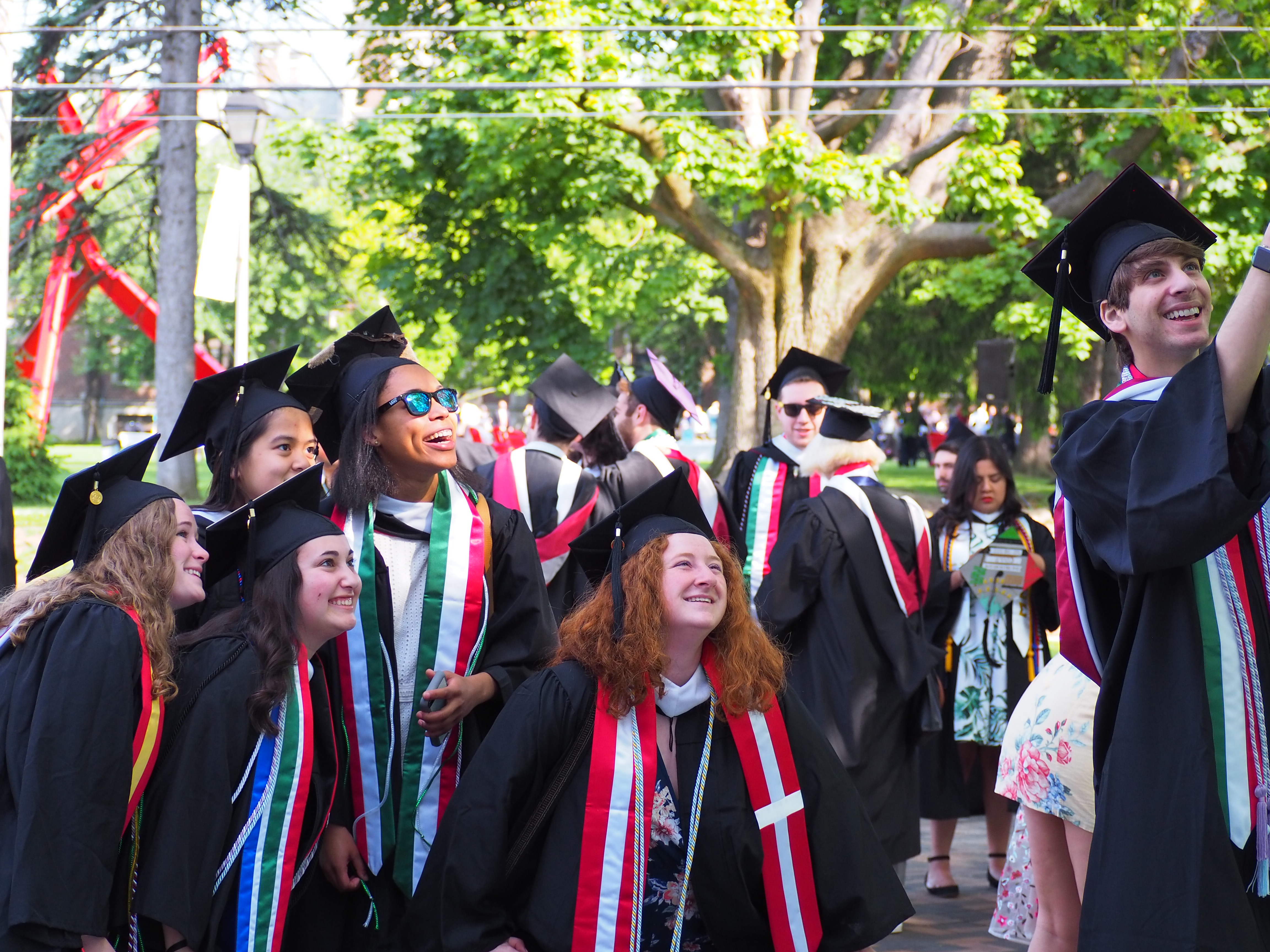 Students posing for selfie at graduation