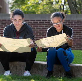 Students reading outside